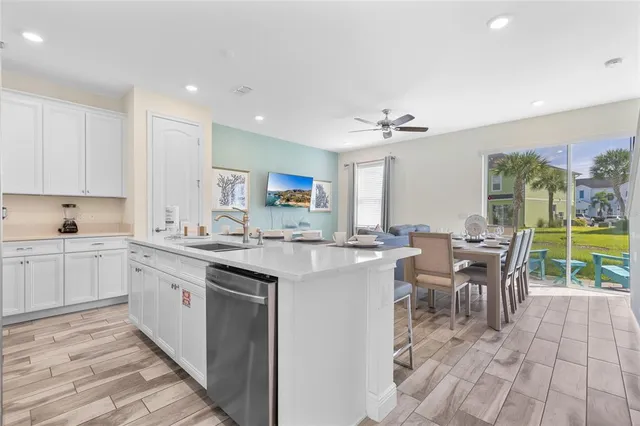 a open kitchen with stainless steel appliances granite countertop a sink and cabinets