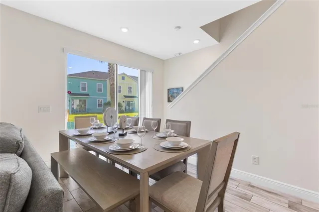 a view of a dining room with furniture window and outside view