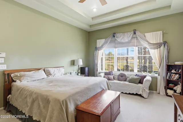 a bath tub sitting next to a window