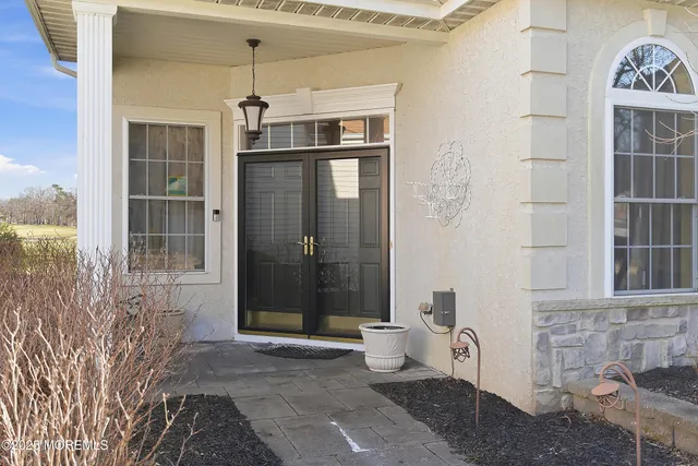 a view of a livingroom with furniture and chandelier
