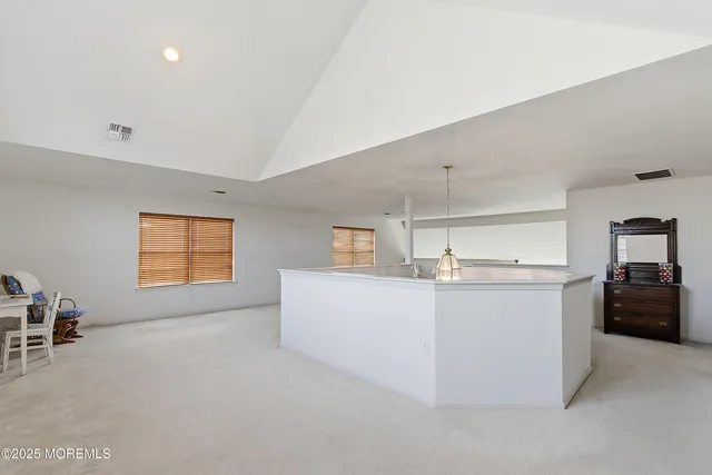a view of a kitchen with furniture and cabinet area