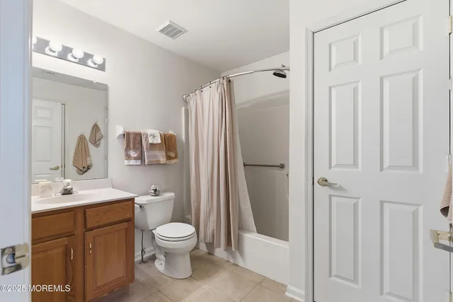 a front view of a house with outdoor seating