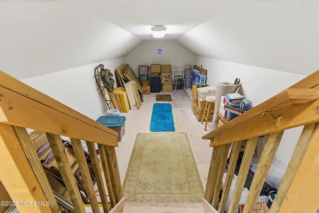 a view of a big house with a big yard and trees