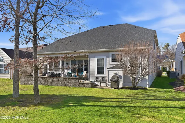 a view of a garden with flowers and trees