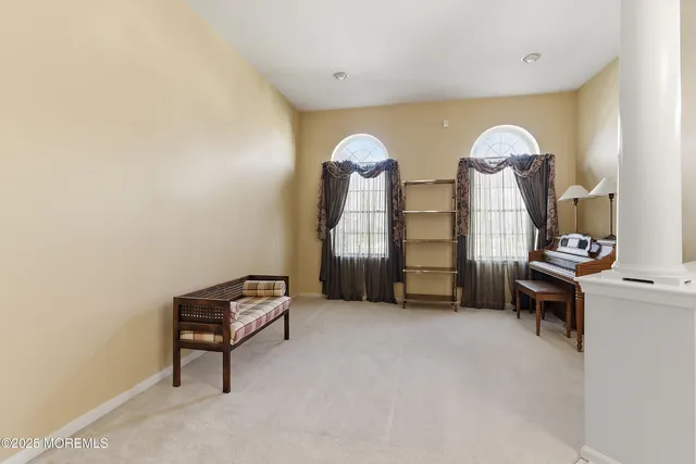 a dining room with a table and chairs