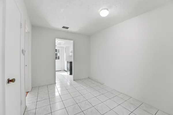 a view of an empty room and window