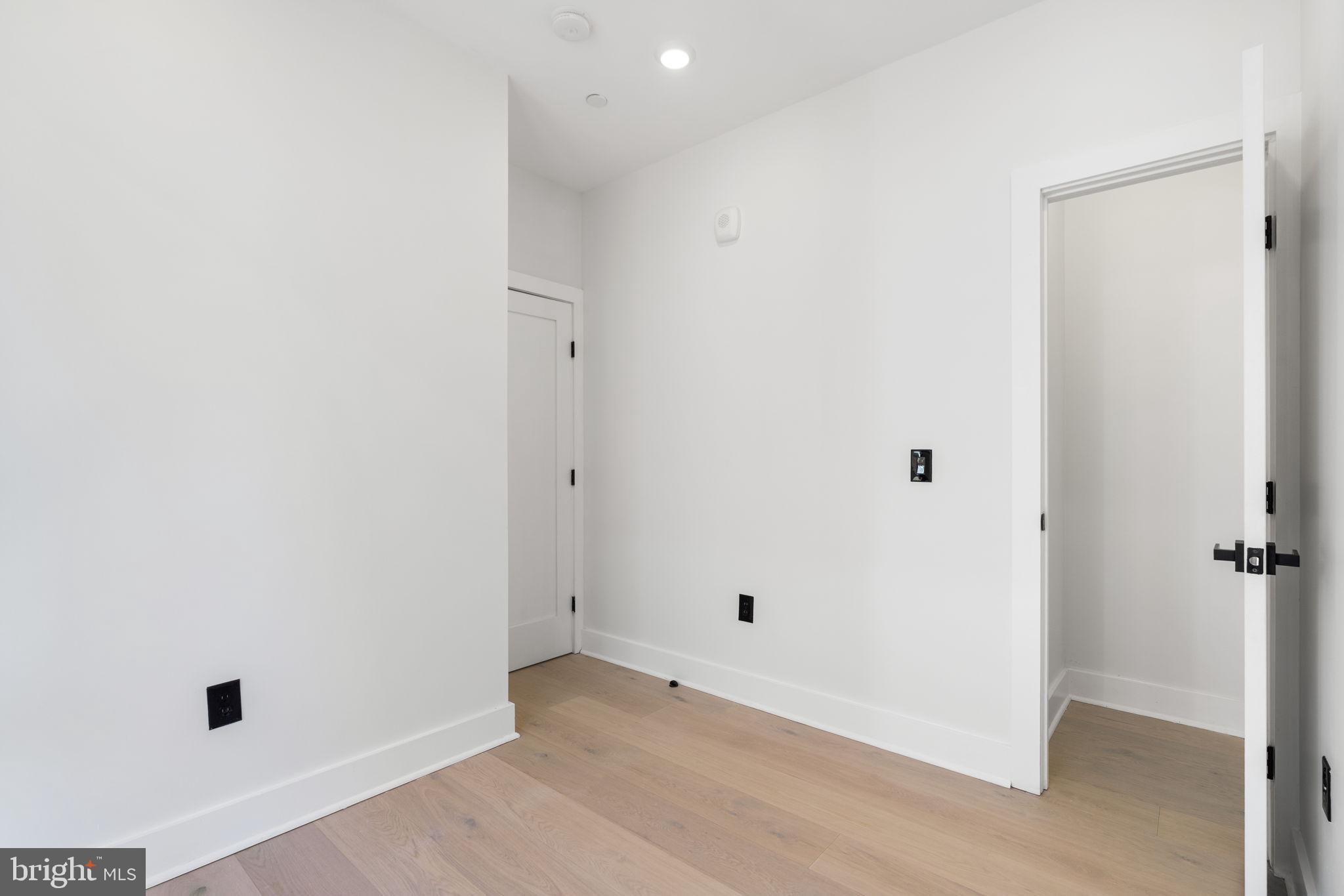 2504 41st Street Northwest, Unit 5 Washington, DC 20007 - Photo 12 of 24 an empty room with a door
