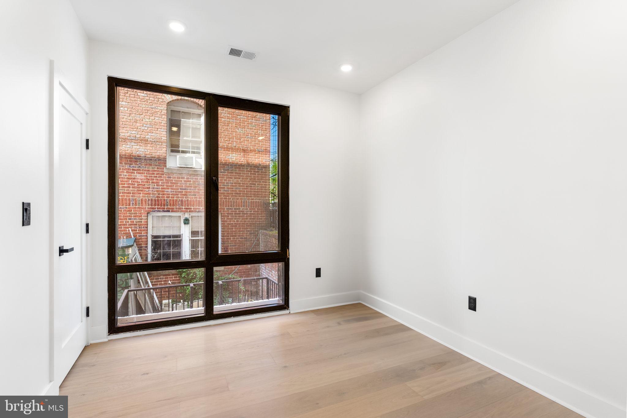 2504 41st Street Northwest, Unit 5 Washington, DC 20007 - Photo 13 of 24 a view of an empty room with a window