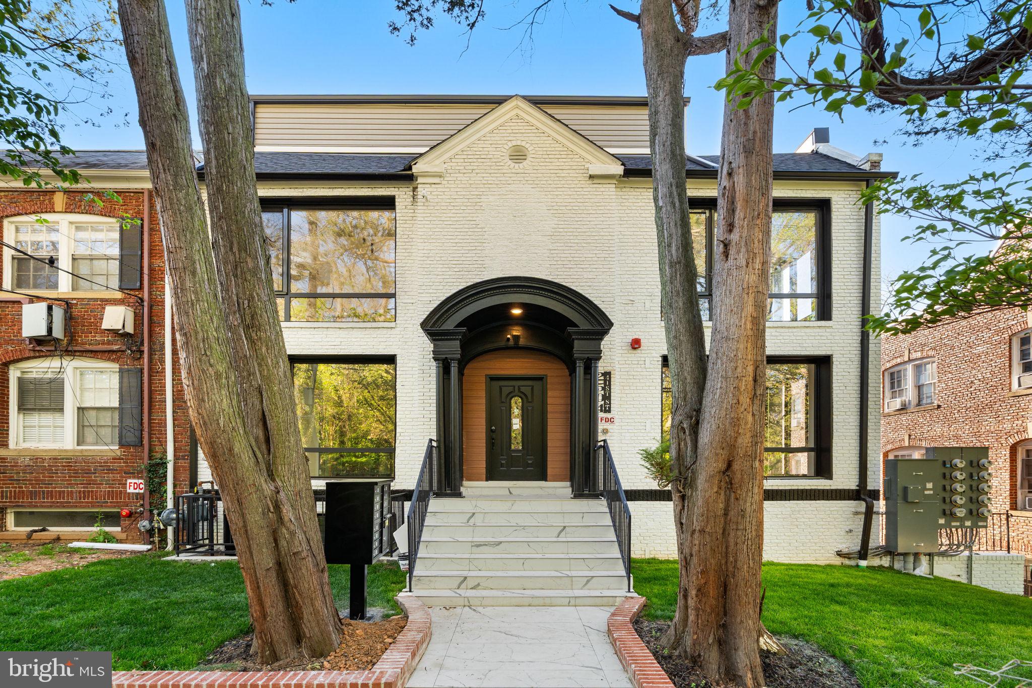2504 41st Street Northwest, Unit 5 Washington, DC 20007 - Photo 3 of 24 a front view of a house with garden