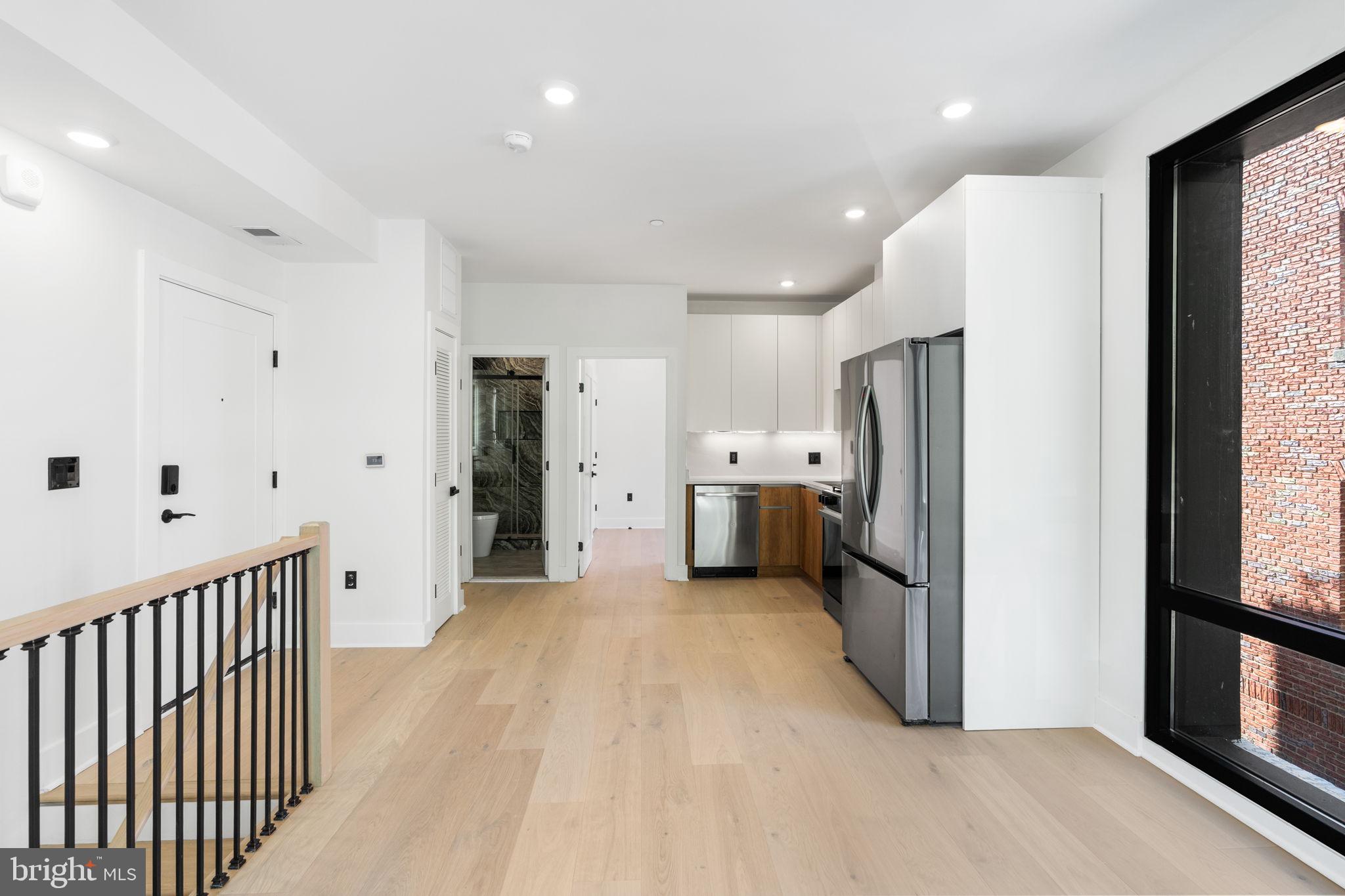 2504 41st Street Northwest, Unit 5 Washington, DC 20007 - Photo 9 of 24 a view of a kitchen with refrigerator and a stove