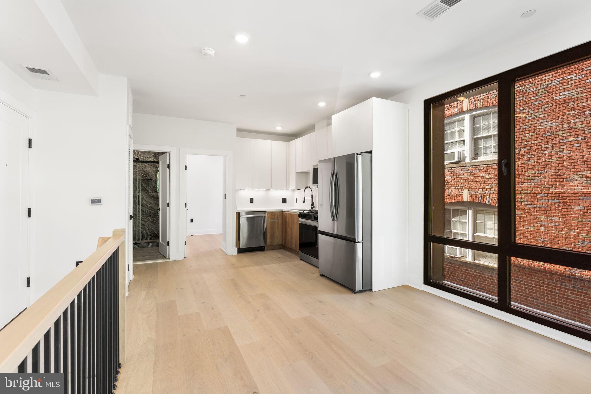 2504 41st Street Northwest, Unit 5 Washington, DC 20007 - Photo 10 of 24 a kitchen with stainless steel appliances a refrigerator and a sink