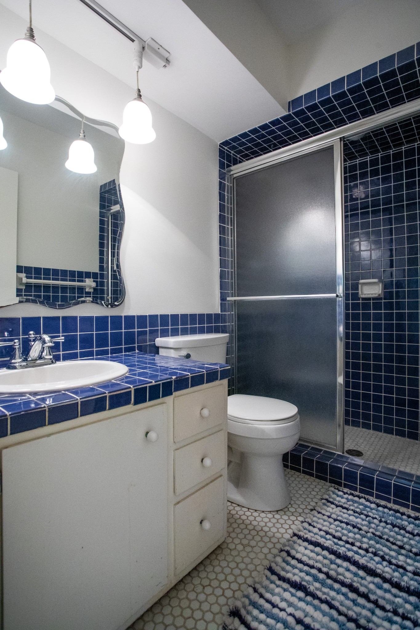 283 Green's View Road Sewanee, TN 37375 - Photo 11 of 50 a bathroom with a toilet a sink and mirror