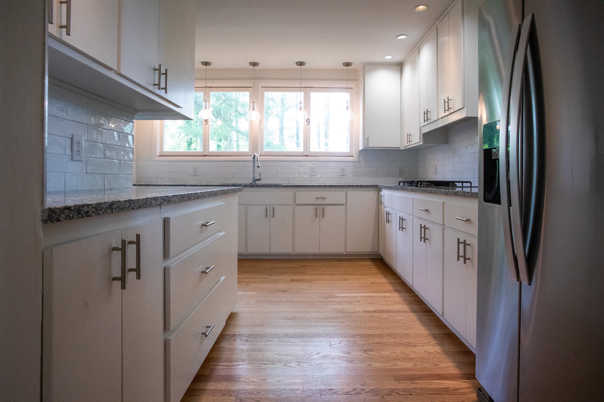 283 Green's View Road Sewanee, TN 37375 - Photo 17 of 50 a kitchen with stainless steel appliances granite countertop a refrigerator a sink and a stove