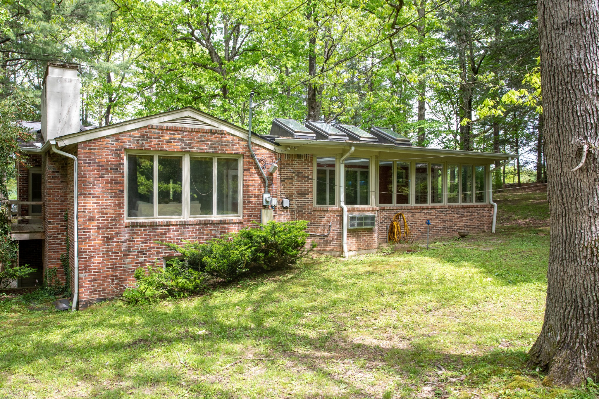 283 Green's View Road Sewanee, TN 37375 - Photo 3 of 50 a front view of a house with garden