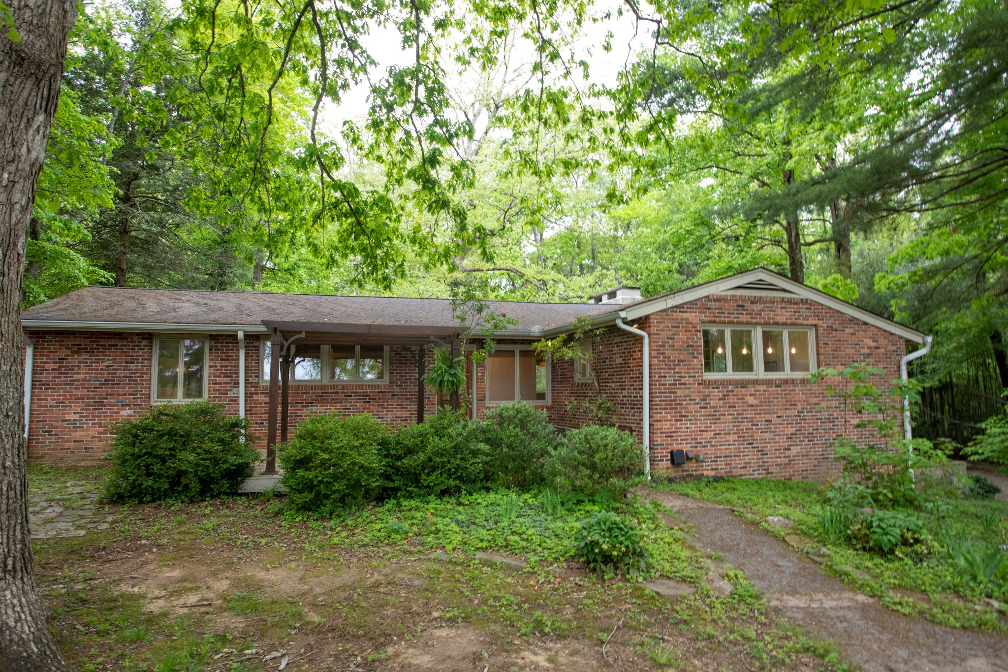 283 Green's View Road Sewanee, TN 37375 - Photo 49 of 50 a front view of a house with a garden