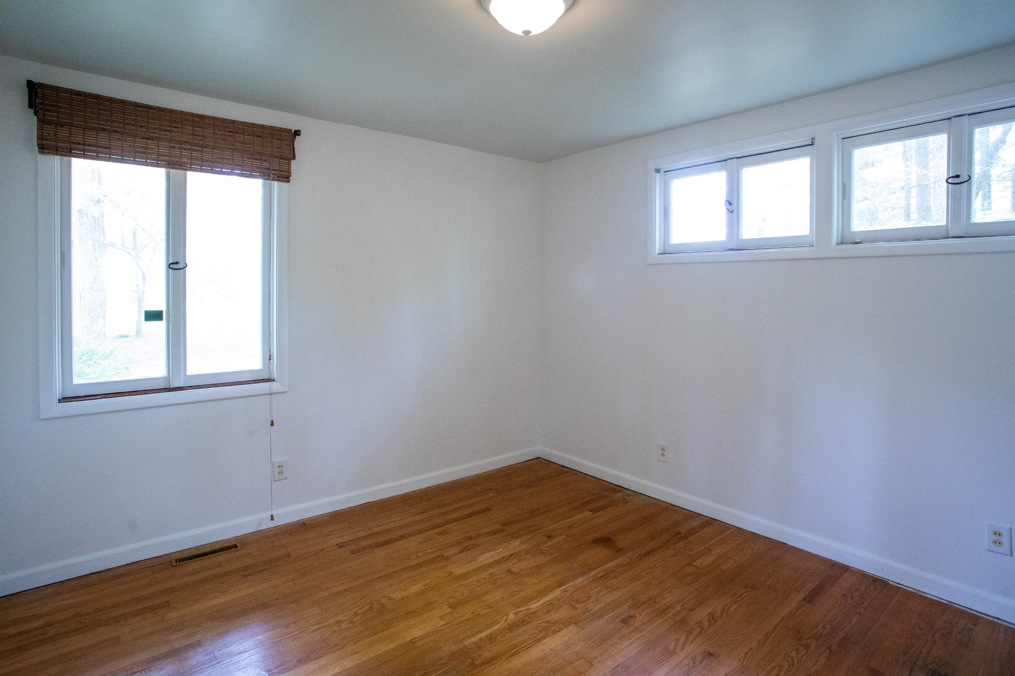 283 Green's View Road Sewanee, TN 37375 - Photo 9 of 50 an empty room with wooden floor and windows
