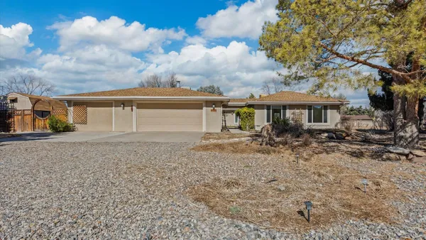 a view of a house with a backyard