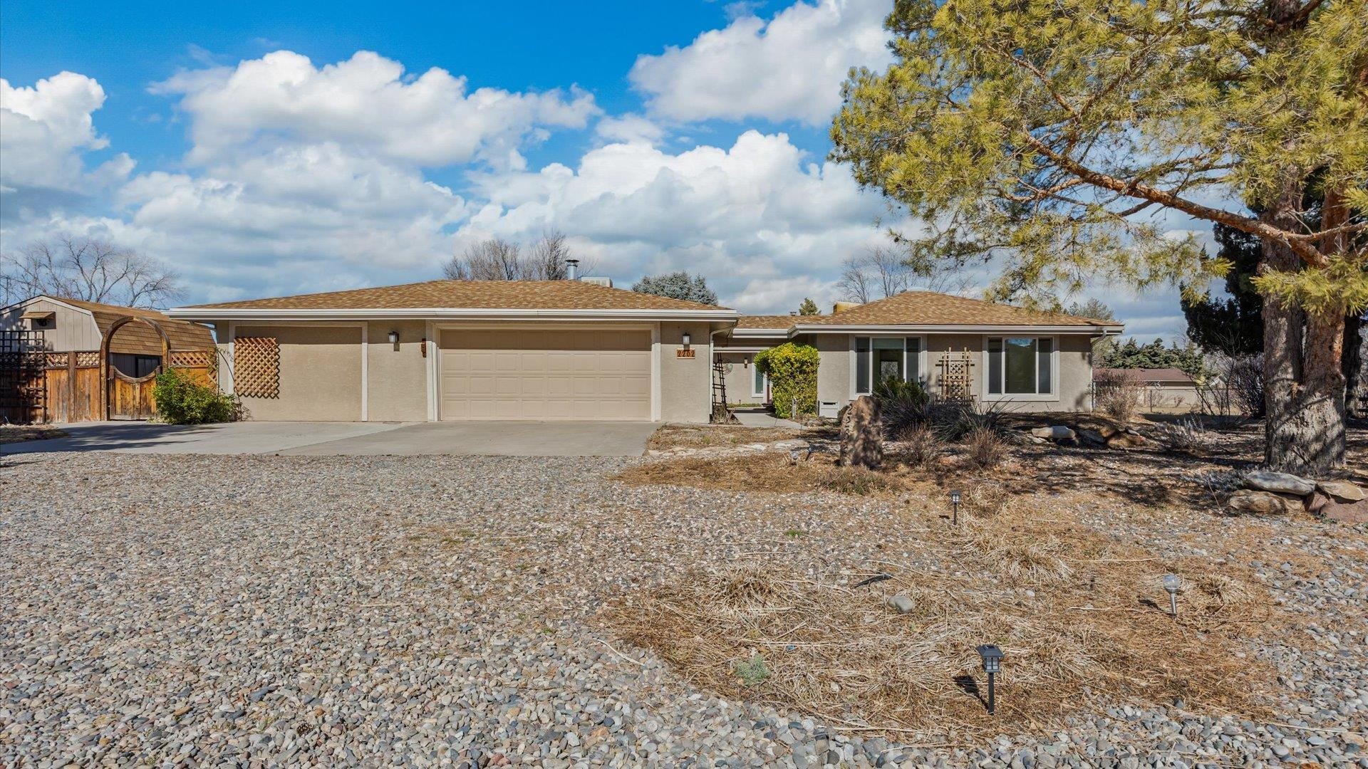 a view of a house with a backyard