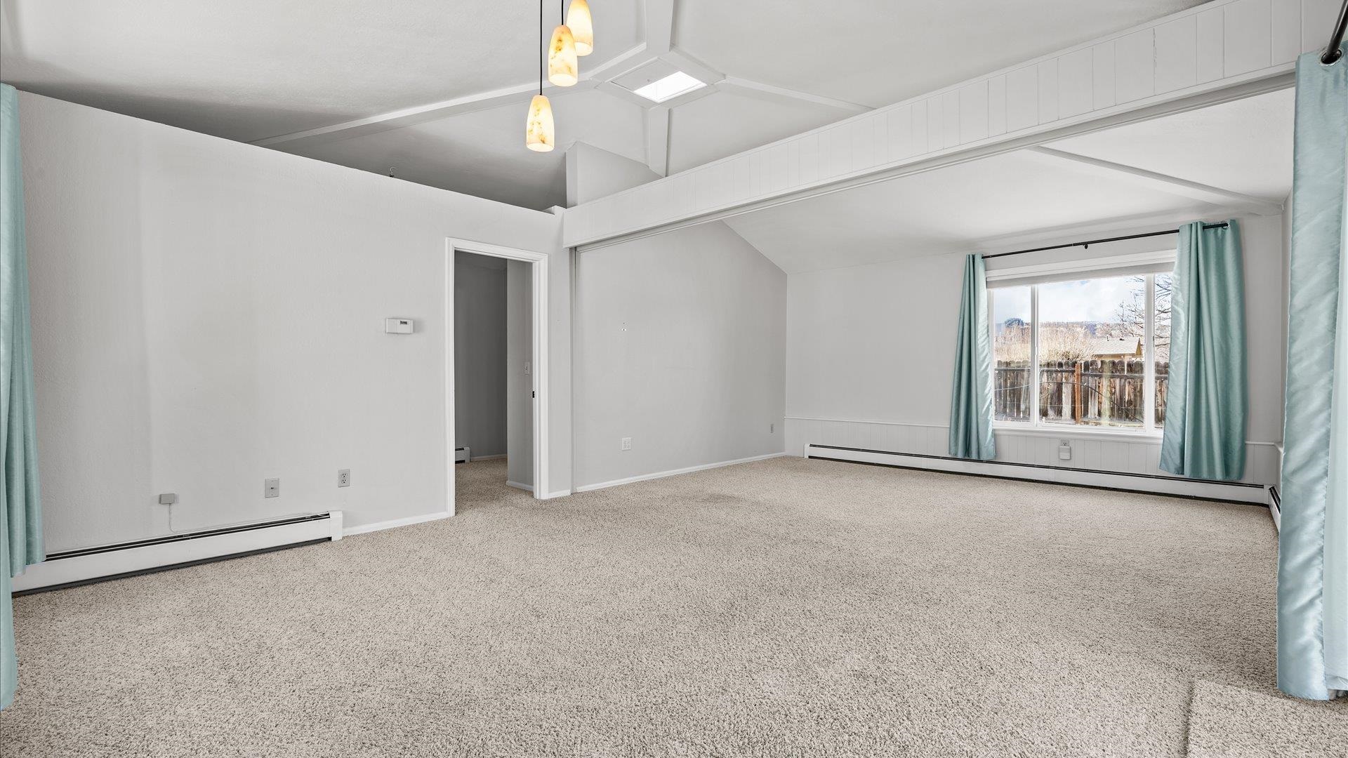 2262 Tanglewood Road Grand Junction, CO 81507 - Photo 11 of 27 an empty room with chandelier fan