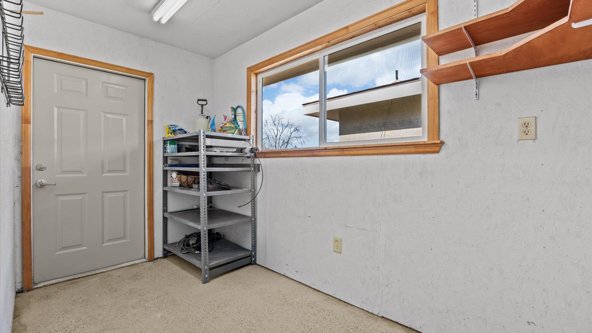 2262 Tanglewood Road Grand Junction, CO 81507 - Photo 22 of 27 a wooden shelves and closet in a room
