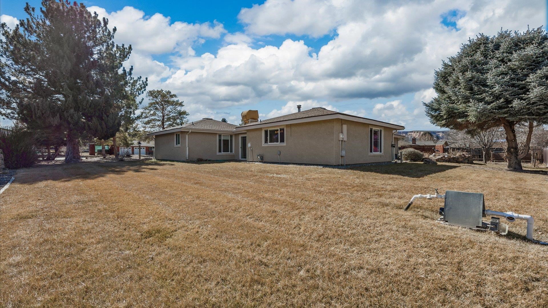2262 Tanglewood Road Grand Junction, CO 81507 - Photo 26 of 27 a view of residential houses with cars parked in front of house
