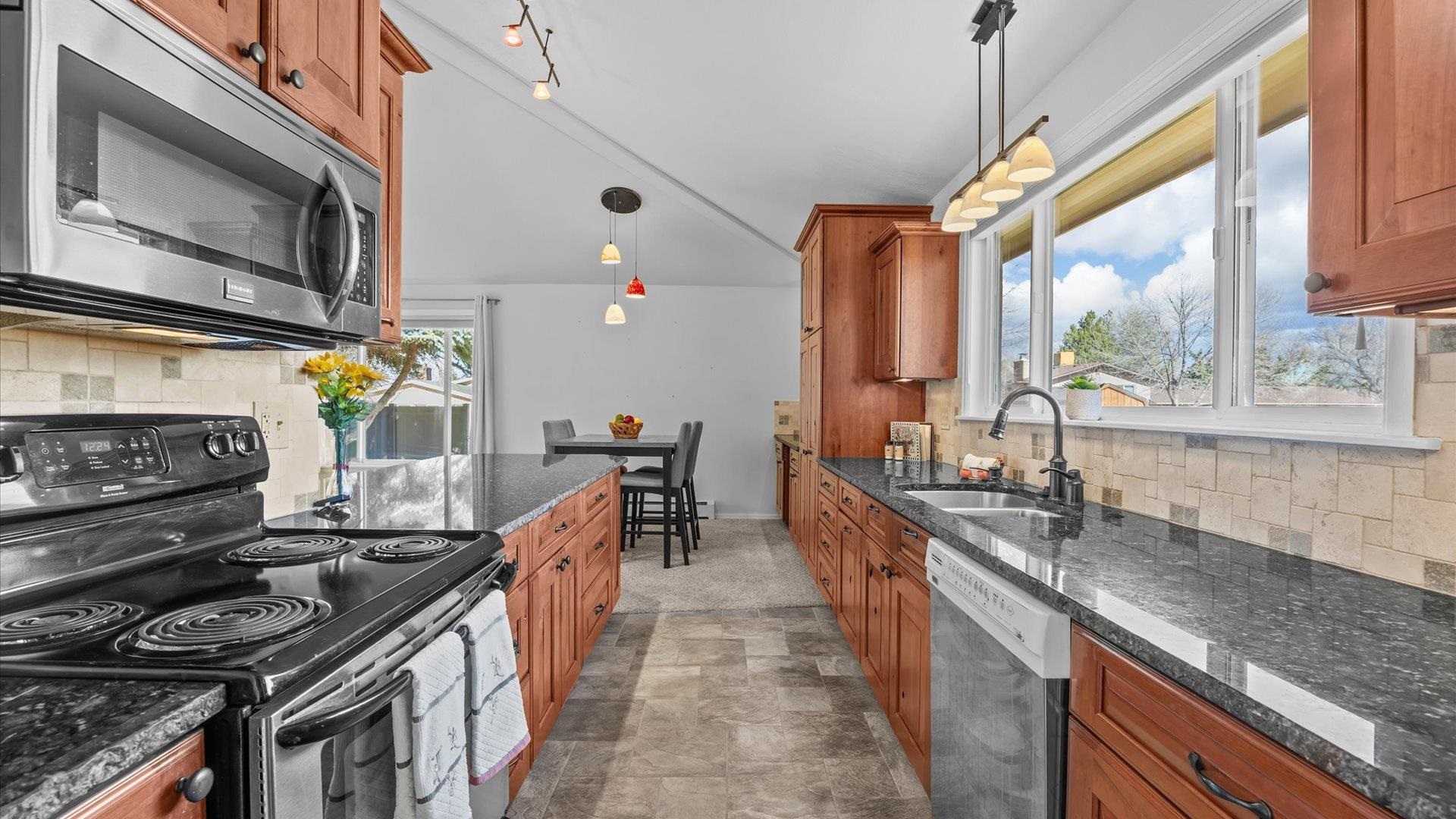 2262 Tanglewood Road Grand Junction, CO 81507 - Photo 10 of 27 a kitchen with lots of counter top space and stainless steel appliances