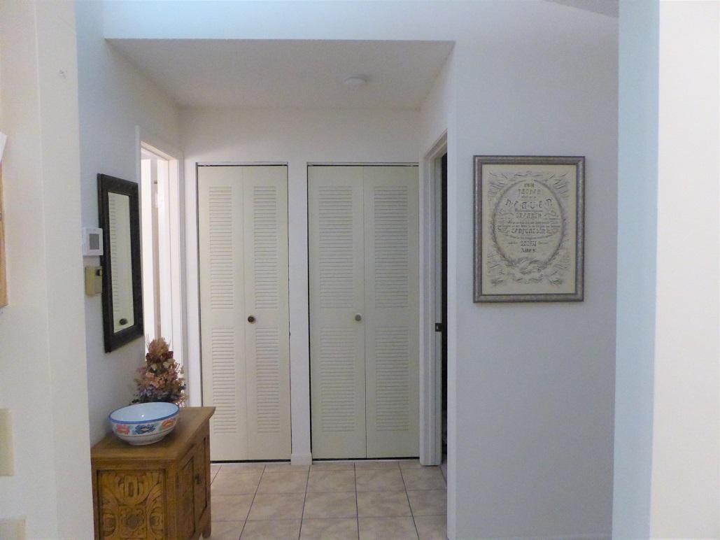 602 Pinecrest Circle, Unit B Jupiter, FL 33458 - Photo 7 of 19 a view of an entryway with wooden floor