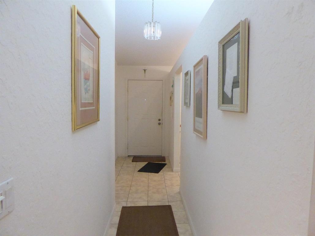 602 Pinecrest Circle, Unit B Jupiter, FL 33458 - Photo 8 of 19 a bathroom with a shower and mirror