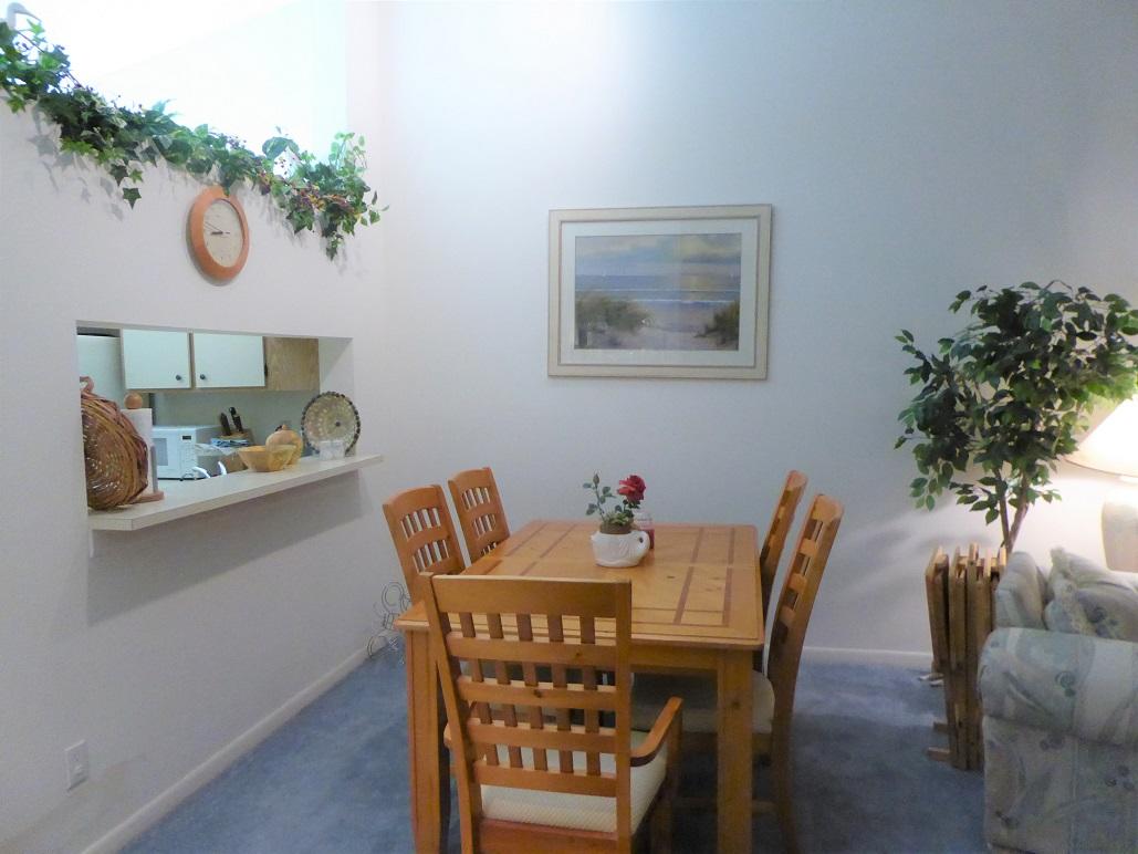 602 Pinecrest Circle, Unit B Jupiter, FL 33458 - Photo 10 of 19 a view of a dining room with furniture and wooden floor