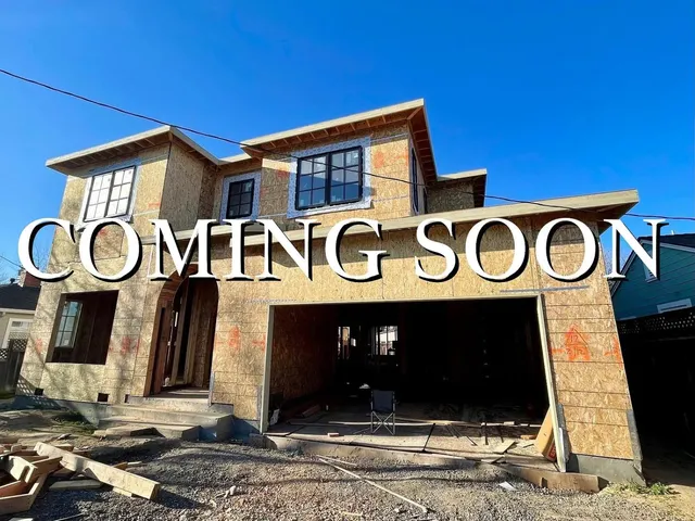 a front view of a building with parking