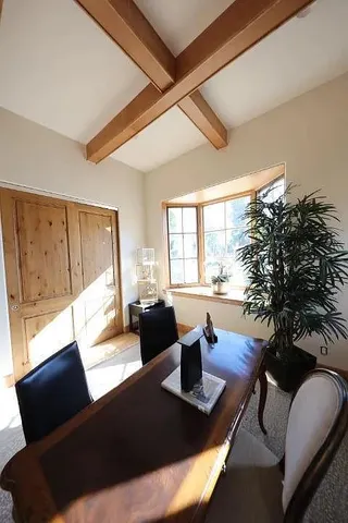 a living room with furniture rug and a large window