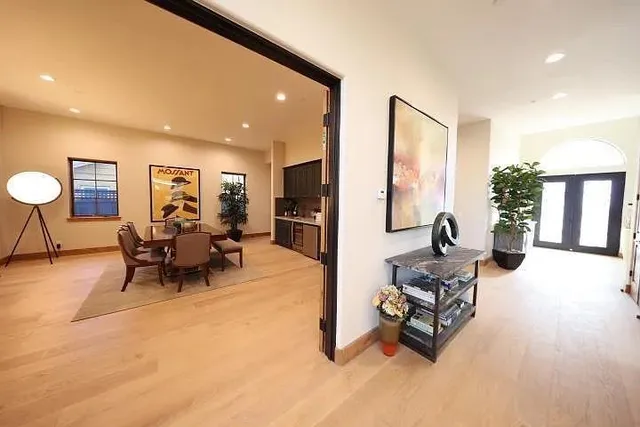 a living room with furniture and a large window