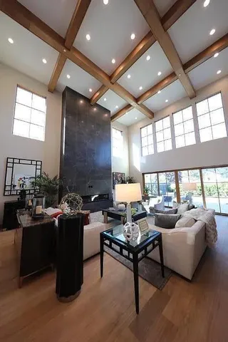 a living room with furniture a window and a table