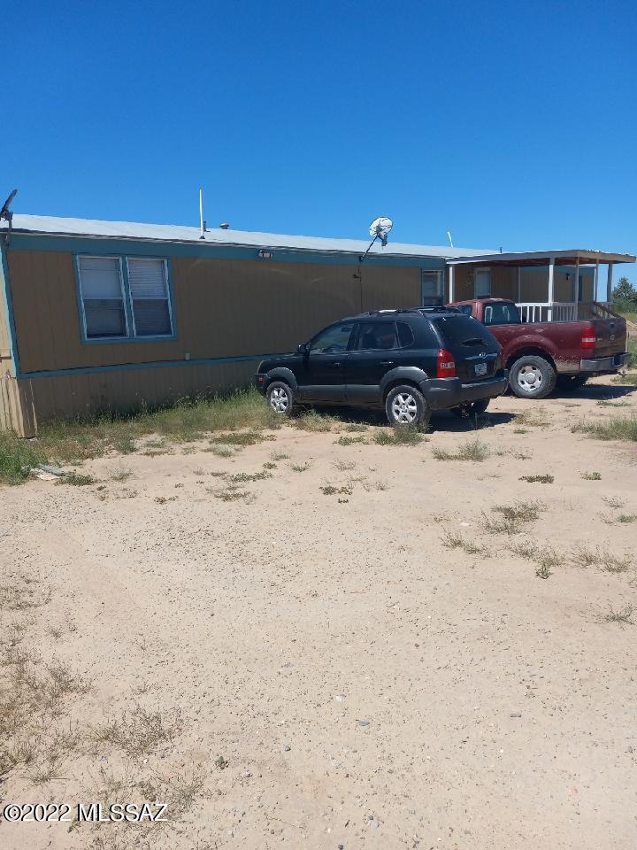 1453 North Taylor Road Willcox, AZ 85643 - Photo 3 of 31 a car parked in front of a house