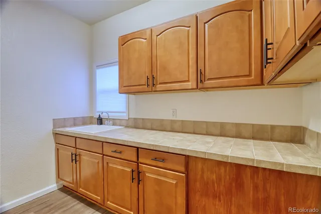 a kitchen with a sink and cabinets