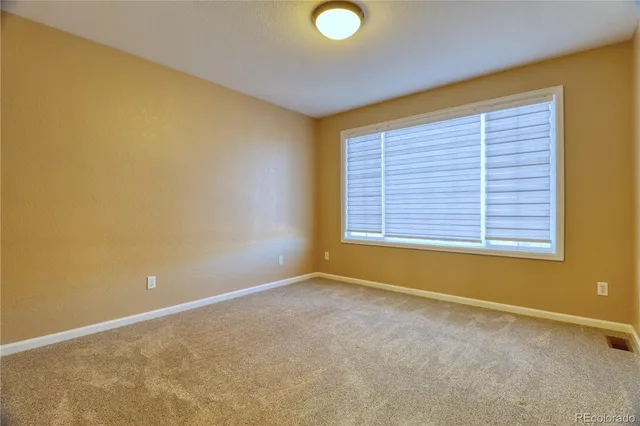 a view of a big room with windows