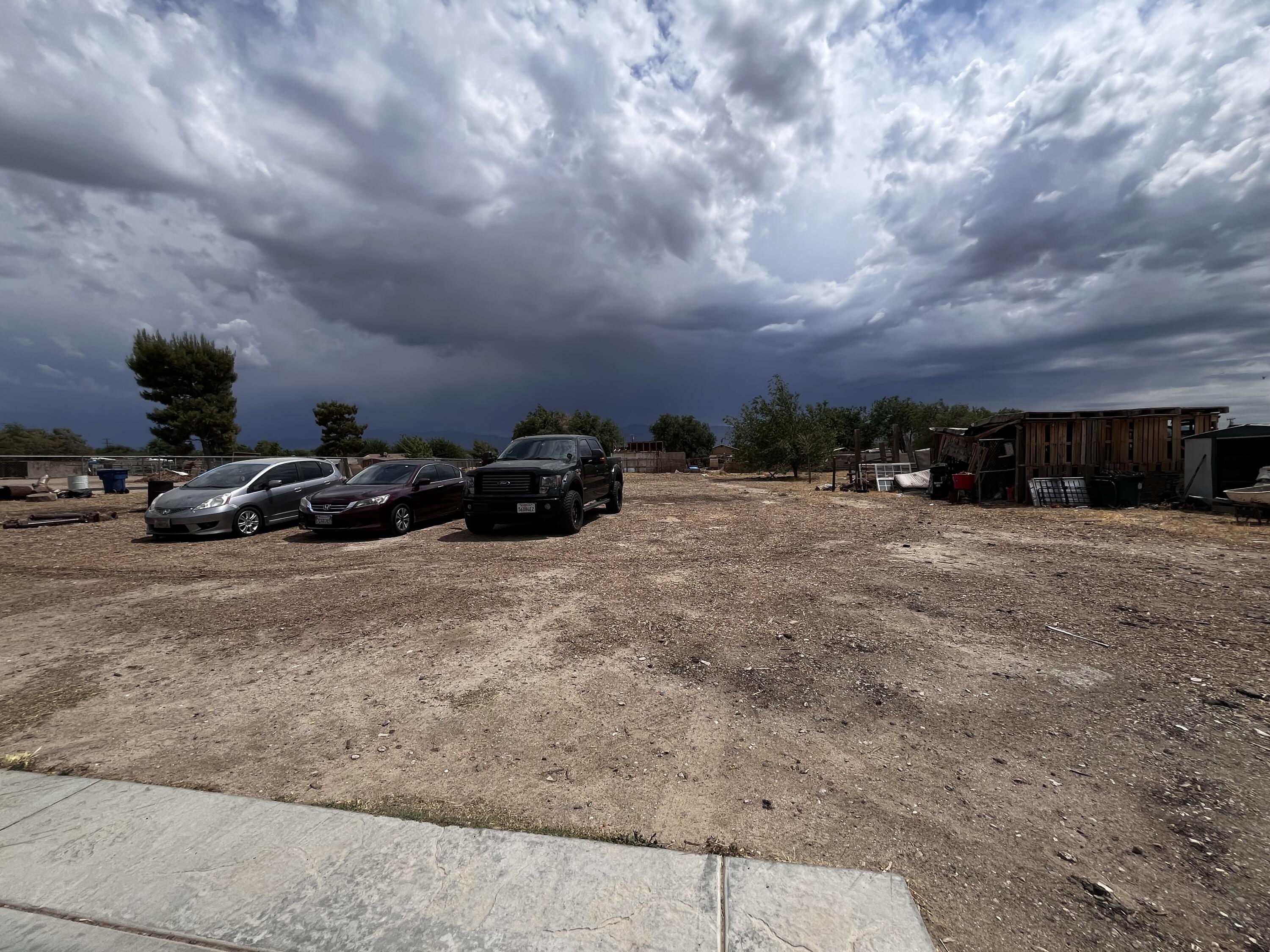 10306 East Ave R 10 Littlerock, CA 93543 - Photo 6 of 7 a view of car parked in middle of a field
