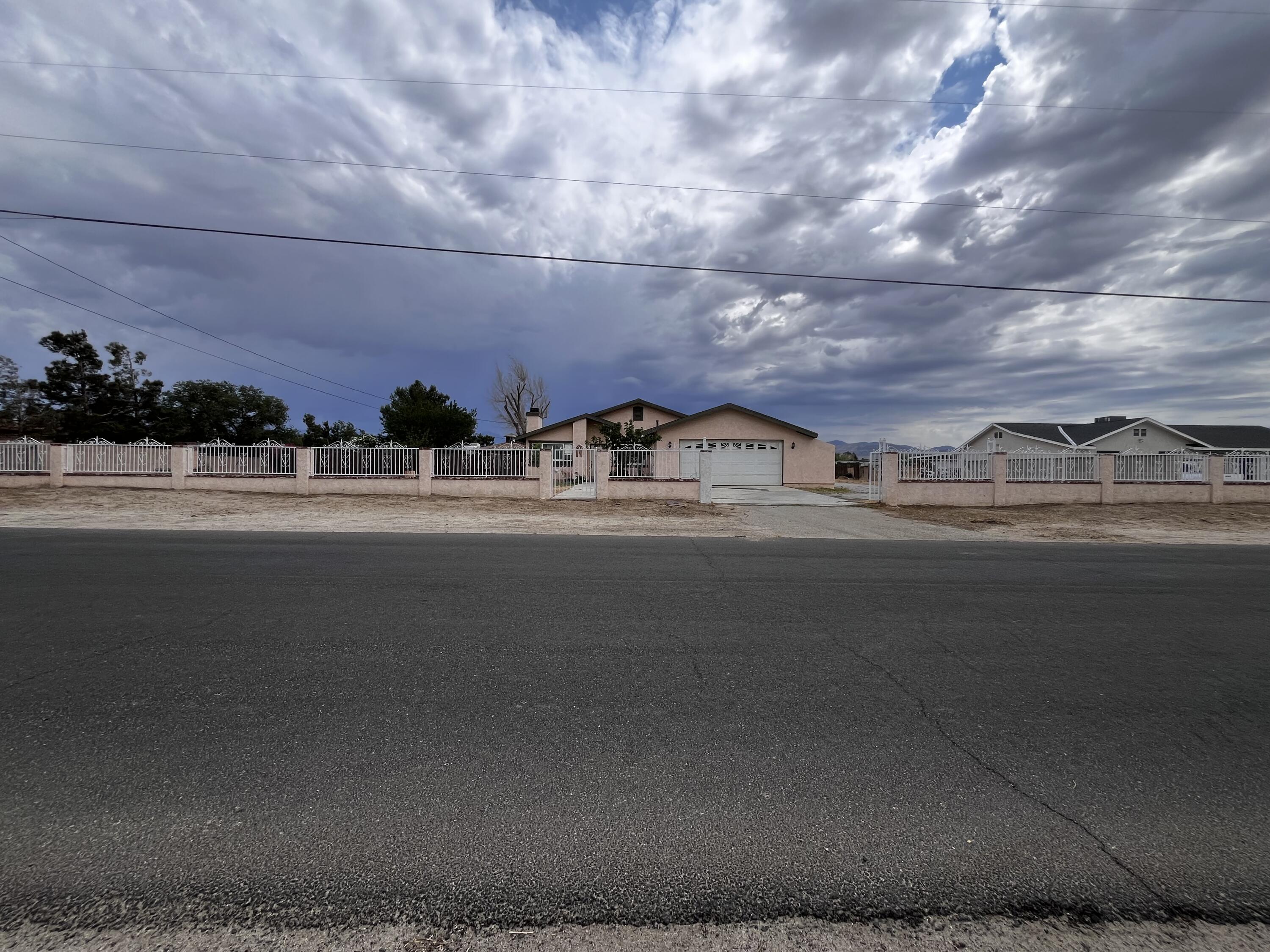 10306 East Ave R 10 Littlerock, CA 93543 - Photo 7 of 7 a view of a street
