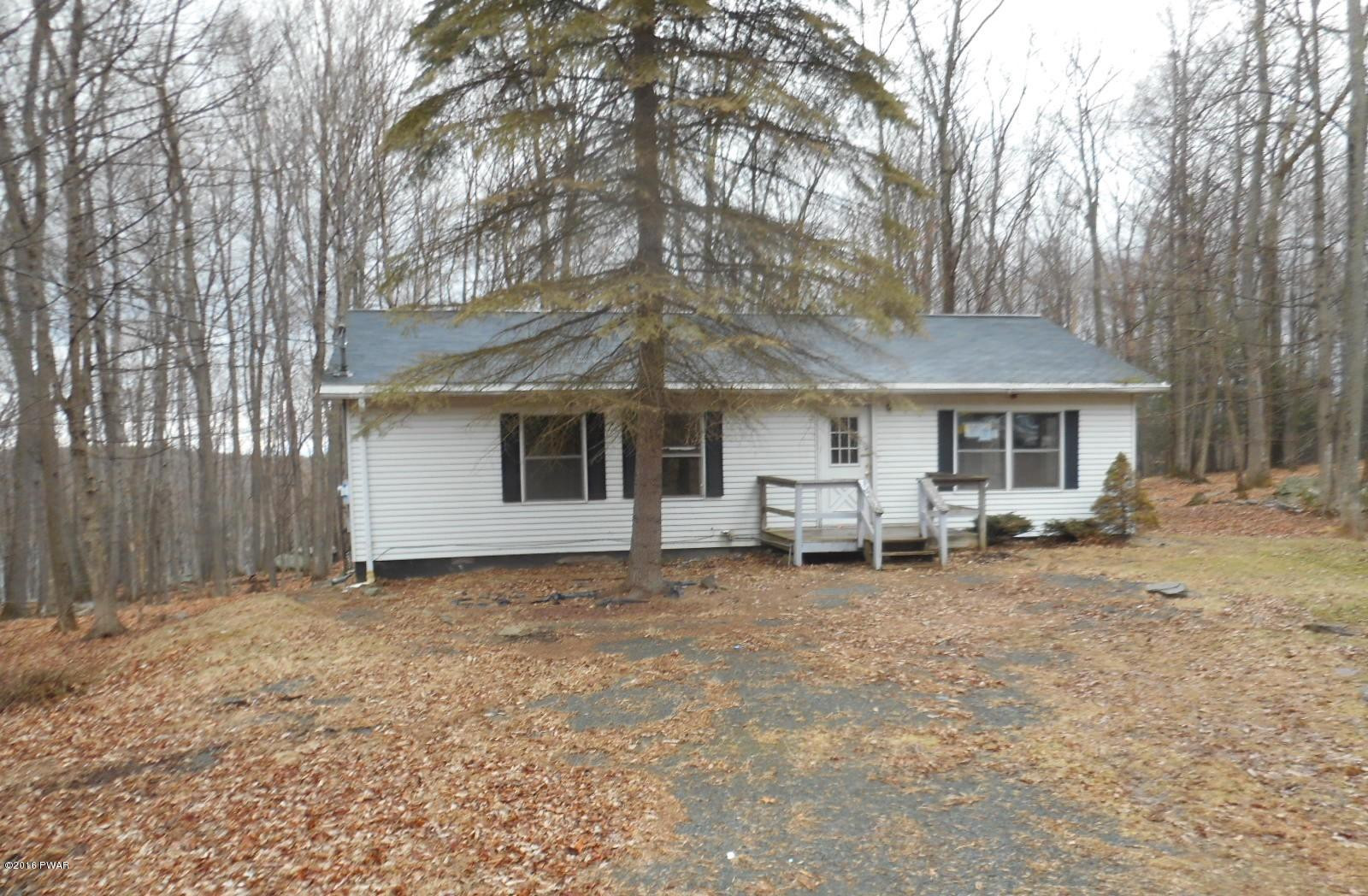 544 Hummingbird Lane Hawley, PA 18428 - Photo 1 of 16 a view of a house with a patio