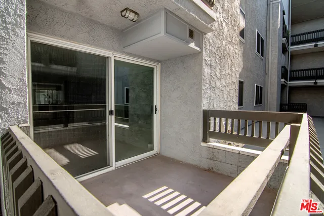 a view of balcony with a potted plant