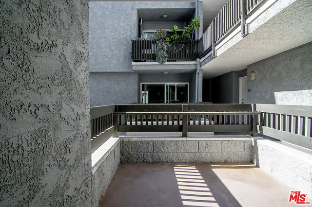 a view of balcony with furniture