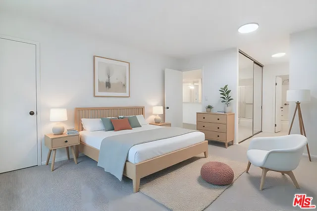 a room with a bed and a chair