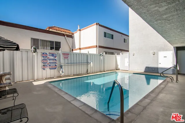 a swimming pool with a outdoor seating