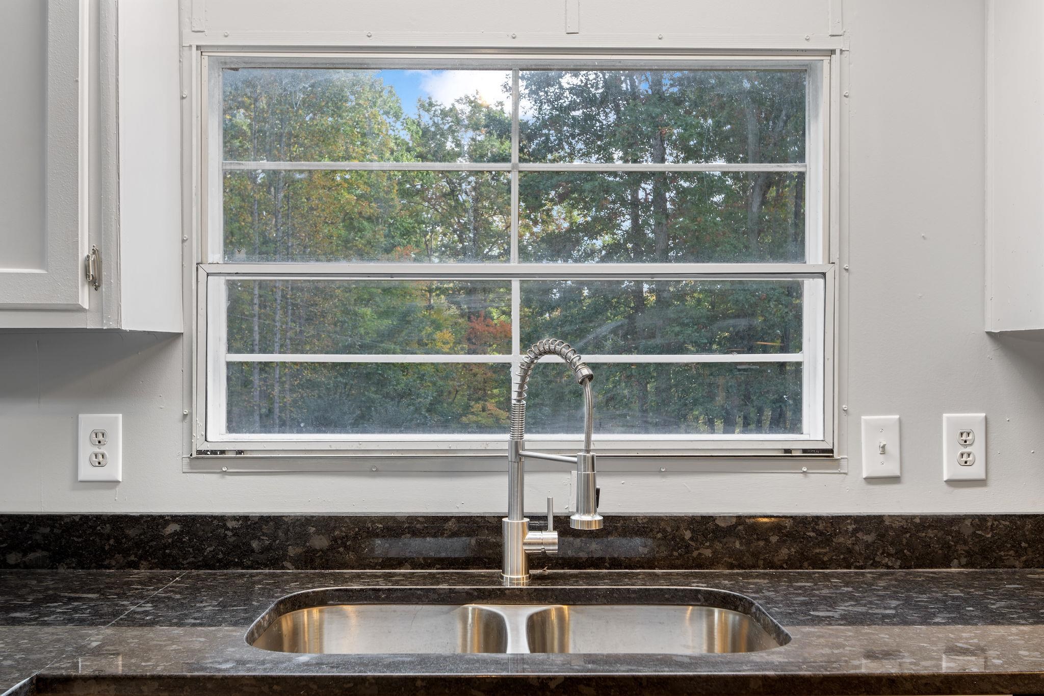 1253 Copper Mine Road Dillwyn, VA 23936 - Photo 8 of 40 a sink with a bench and a window