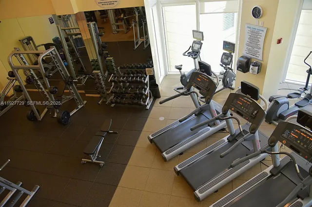 a dining area with furniture and window