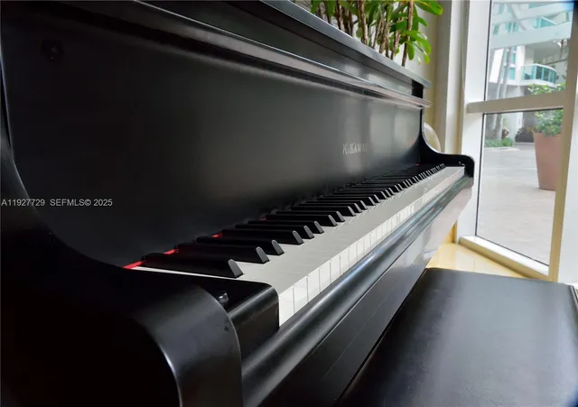 a living room with furniture and a book shelf