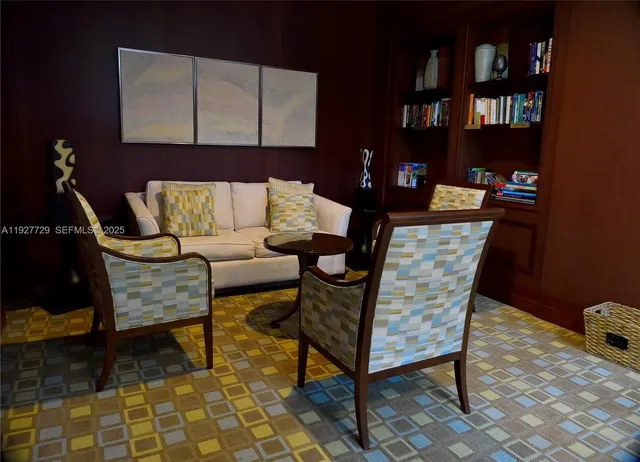 a view of a dining room with furniture and window
