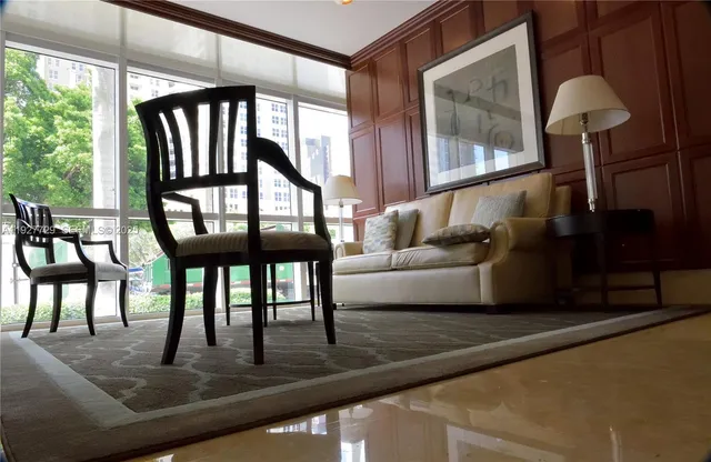 a green field with some trees