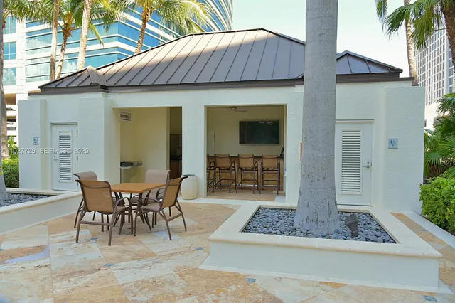 a view of a living room with furniture and a flat screen tv