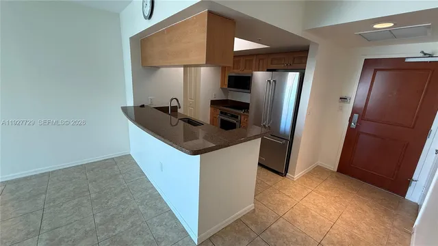 a view of an empty room with glass door